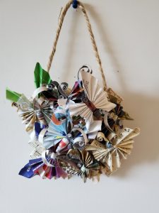 A wall hanging made from greeting cards